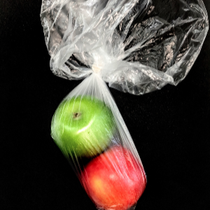 Two apples in single use plastic produce bag.