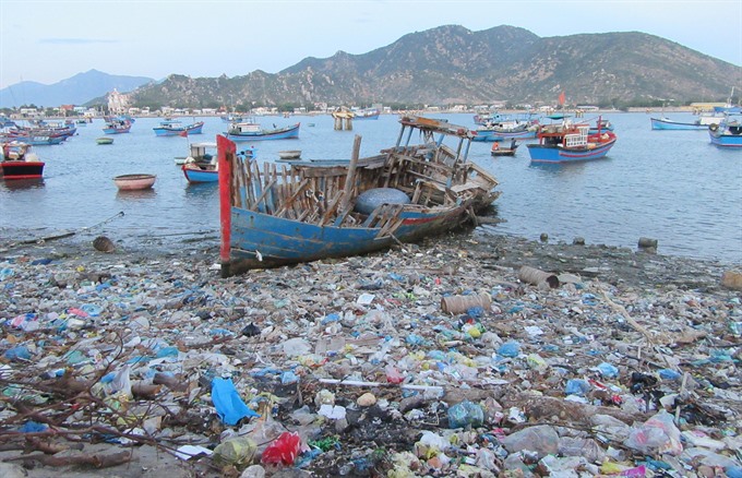 Beach covered in trash/plastic waste in Vietnam.